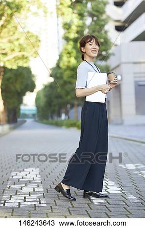 Young Japanese woman outside View Large Photo Image Stock Image - Young Japanese woman outside. Fotosearch