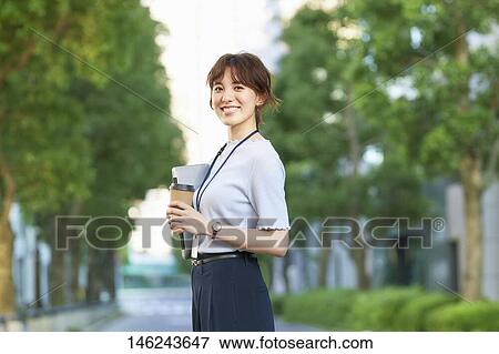 Young Japanese woman outside View Large Photo Image Stock Photo - Young Japanese woman outside. Fotosearch