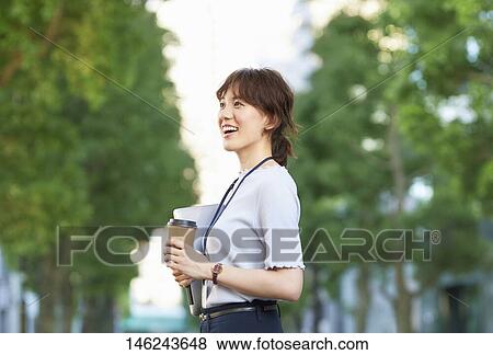 Stock Photo - Young Japanese woman outside. Fotosearch