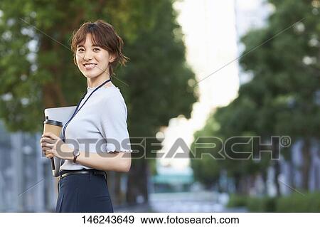 Stock Photo - Young Japanese woman outside. Fotosearch