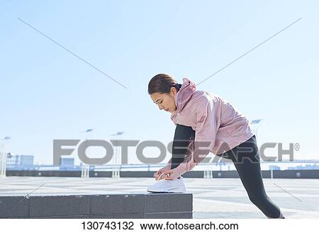 Young Japanese Woman Stretching Downtown Tokyo, Japan View Large Photo Image Stock Image - Young Japanese Woman Stretching Downtown Tokyo, Japan. Fotosearch