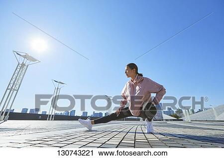 Young Japanese Woman Stretching Downtown Tokyo, Japan View Large Photo Image Stock Image - Young Japanese Woman Stretching Downtown Tokyo, Japan. Fotosearch