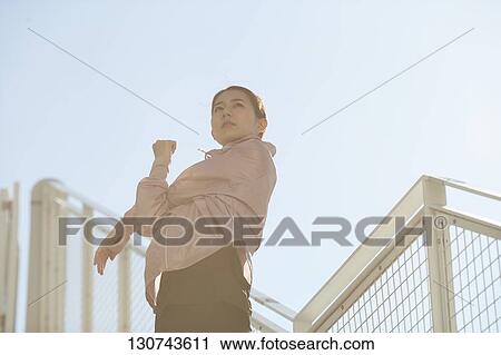Young Japanese Woman Stretching Downtown Tokyo, Japan View Large Photo Image Stock Image - Young Japanese Woman Stretching Downtown Tokyo, Japan. Fotosearch