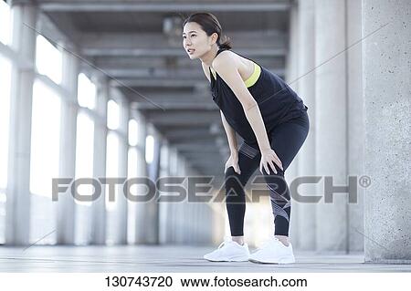 Young Japanese Woman Taking A Break During Jogging View Large Photo Image Stock Image - Young Japanese Woman Taking A Break During Jogging. Fotosearch