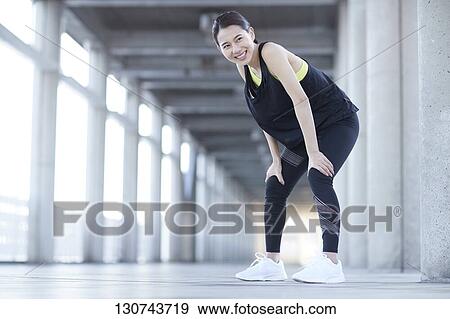Young Japanese Woman Taking A Break During Jogging View Large Photo Image Stock Photo - Young Japanese Woman Taking A Break During Jogging. Fotosearch