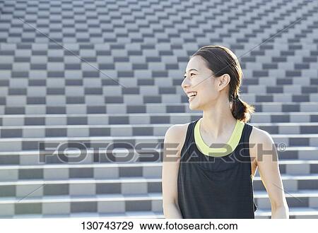Young Japanese Woman Taking A Break During Jogging View Large Photo Image Stock Photo - Young Japanese Woman Taking A Break During Jogging. Fotosearch