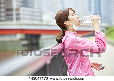 Young Japanese woman training downtown Tokyo View Large Photo Image Stock Image - Young Japanese woman training downtown Tokyo. Fotosearch