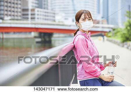 Young Japanese woman training downtown Tokyo View Large Photo Image Stock Image - Young Japanese woman training downtown Tokyo. Fotosearch