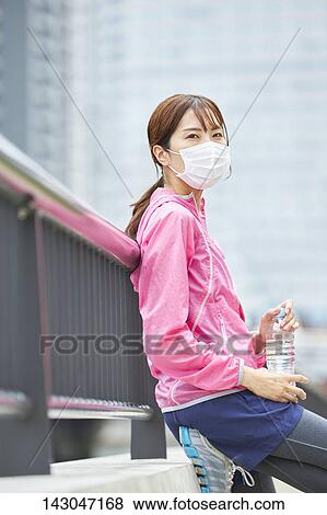 Young Japanese woman training downtown Tokyo View Large Photo Image Stock Photo - Young Japanese woman training downtown Tokyo. Fotosearch