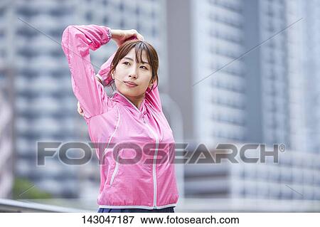 Young Japanese woman training downtown Tokyo View Large Photo Image Stock Photo - Young Japanese woman training downtown Tokyo. Fotosearch