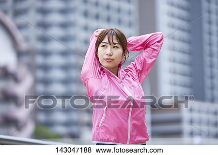 Young Japanese woman training downtown Tokyo View Large Photo Image Stock Photo - Young Japanese woman training downtown Tokyo. Fotosearch