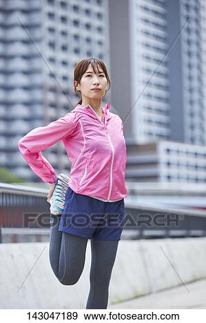 Young Japanese woman training downtown Tokyo View Large Photo Image Stock Photo - Young Japanese woman training downtown Tokyo. Fotosearch