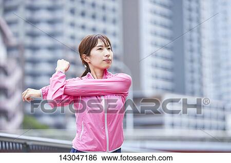 Young Japanese woman training downtown Tokyo View Large Photo Image Stock Photograph - Young Japanese woman training downtown Tokyo. Fotosearch