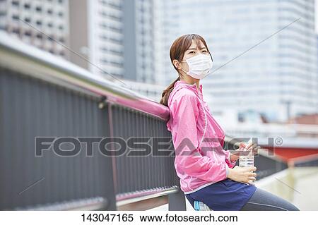 Young Japanese woman training downtown Tokyo View Large Photo Image Stock Photography - Young Japanese woman training downtown Tokyo. Fotosearch