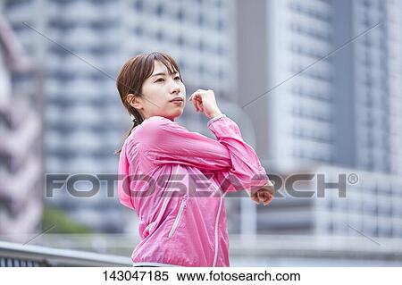 Stock Photography - Young Japanese woman training downtown Tokyo. Fotosearch