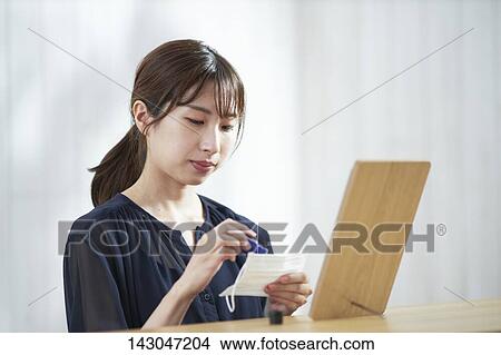 Young Japanese woman using mirror at home View Large Photo Image Picture - Young Japanese woman using mirror at home. Fotosearch