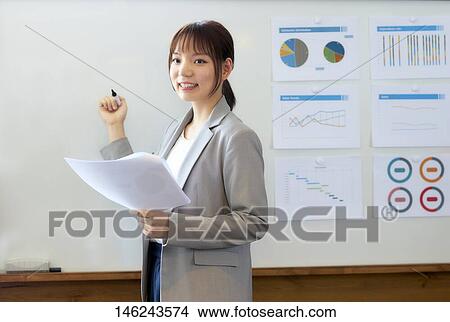 Young Japanese woman working View Large Photo Image Picture - Young Japanese woman working. Fotosearch