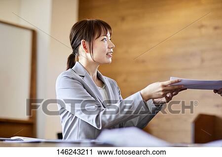 Young Japanese woman working View Large Photo Image Stock Image - Young Japanese woman working. Fotosearch