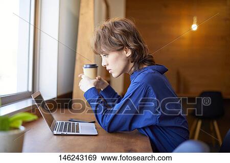 Young Japanese woman working View Large Photo Image Stock Photo - Young Japanese woman working. Fotosearch