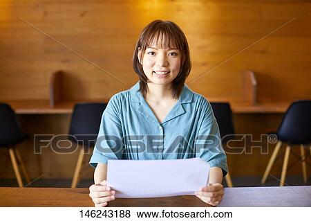 Young Japanese woman working View Large Photo Image Stock Photo - Young Japanese woman working. Fotosearch