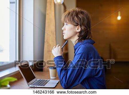 Stock Photograph - Young Japanese woman working. Fotosearch