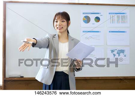 Young Japanese woman working View Large Photo Image Stock Photograph - Young Japanese woman working. Fotosearch