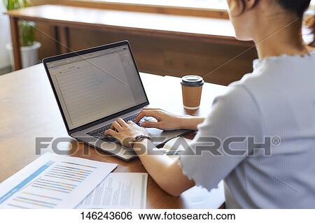 Young Japanese woman working View Large Photo Image Stock Photograph - Young Japanese woman working. Fotosearch
