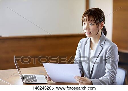 Young Japanese woman working View Large Photo Image Stock Photography - Young Japanese woman working. Fotosearch
