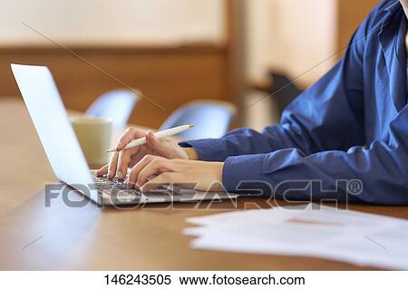 Young Japanese woman working View Large Photo Image Stock Photography - Young Japanese woman working. Fotosearch