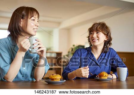 Stock Photo - Young Japanese women at a cafe. Fotosearch