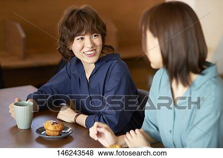 Young Japanese women at a cafe View Large Photo Image Stock Photo - Young Japanese women at a cafe. Fotosearch
