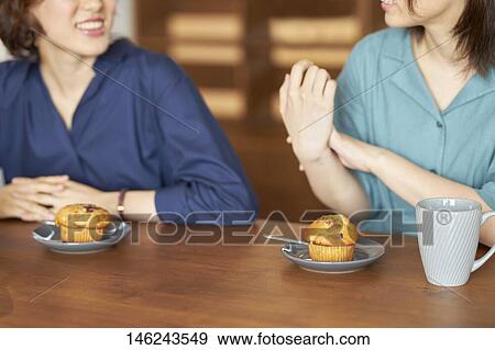Young Japanese women at a cafe View Large Photo Image Stock Photo - Young Japanese women at a cafe. Fotosearch