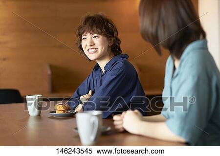 Stock Photography - Young Japanese women at a cafe. Fotosearch