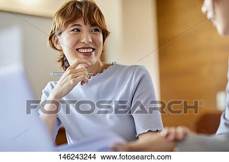 Picture - Young Japanese women working. Fotosearch