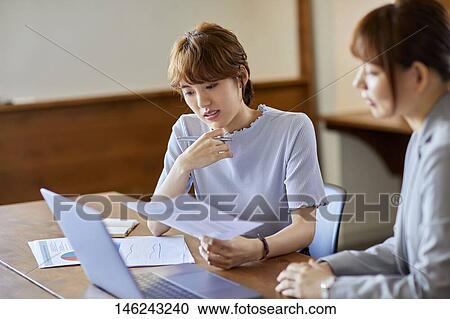 Young Japanese women working View Large Photo Image Stock Image - Young Japanese women working. Fotosearch