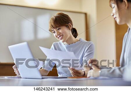 Young Japanese women working View Large Photo Image Stock Image - Young Japanese women working. Fotosearch