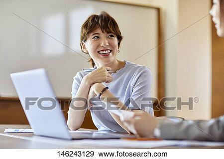 Young Japanese women working View Large Photo Image Stock Photo - Young Japanese women working. Fotosearch