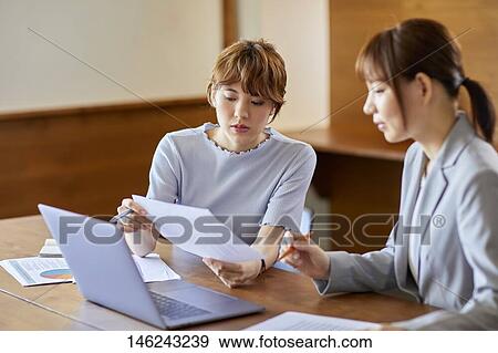 Young Japanese women working View Large Photo Image Stock Photo - Young Japanese women working. Fotosearch