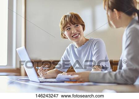 Young Japanese women working View Large Photo Image Stock Photo - Young Japanese women working. Fotosearch