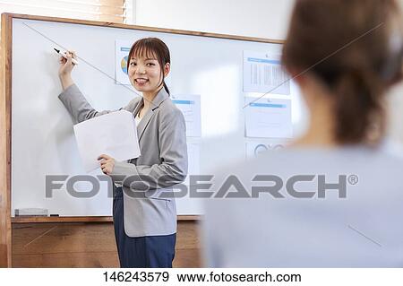 Young Japanese women working View Large Photo Image Stock Photo - Young Japanese women working. Fotosearch