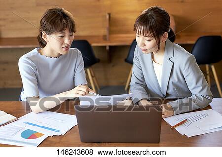 Young Japanese women working View Large Photo Image Stock Photo - Young Japanese women working. Fotosearch