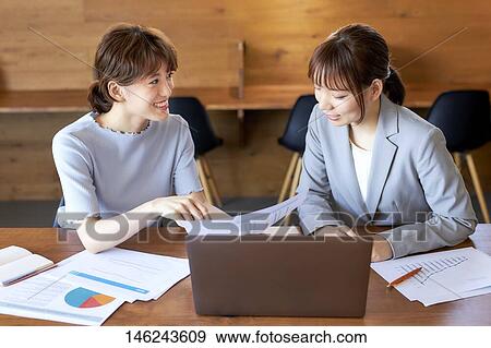 Young Japanese women working View Large Photo Image Stock Photo - Young Japanese women working. Fotosearch