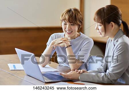 Young Japanese women working View Large Photo Image Stock Photography - Young Japanese women working. Fotosearch