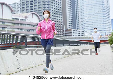 Young Man And Woman Running With Face Mask View Large Photo Image Stock Image - Young Man And Woman Running With Face Mask. Fotosearch