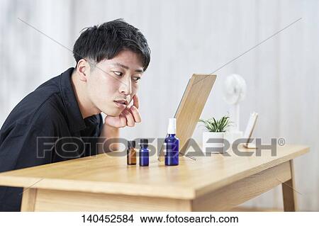 Young Man Checking His Face With A Mirror View Large Photo Image Picture - Young Man Checking His Face With A Mirror. Fotosearch