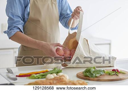 Stock Photo - Young Man In The Kitchen. Fotosearch