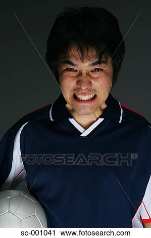 Soccer player grimacing View Large Photo Image Stock Image - Soccer player grimacing. Fotosearch