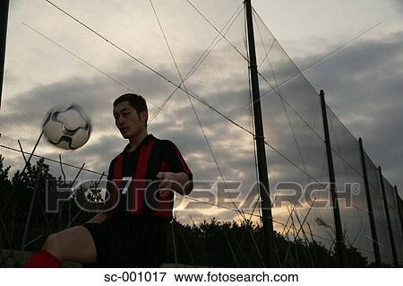 Soccer player juggling ball View Large Photo Image Stock Photo - Soccer player juggling ball. Fotosearch