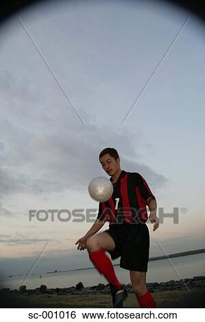 Soccer player juggling ball View Large Photo Image Stock Photograph - Soccer player juggling ball. Fotosearch
