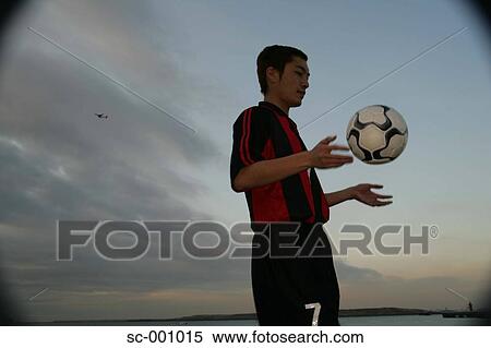 Soccer player juggling ball View Large Photo Image Stock Photography - Soccer player juggling ball. Fotosearch